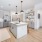 Spacious and well lit kitchen with wood flooring and stainless steel appliances