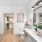 Large well lit bathroom with white accents 